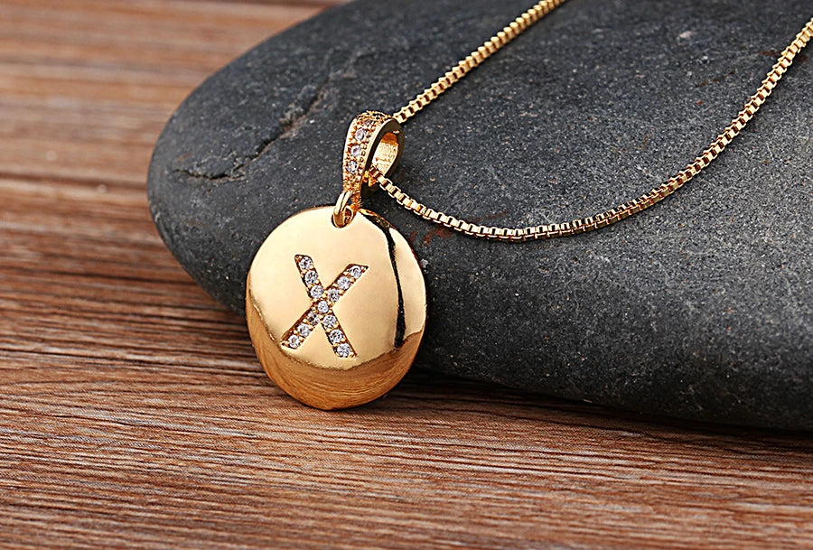 Nidin initial letter necklace featuring a copper pendant with CZ stones, stylish jewelry for women and girls by Mc The Black Diamonds.