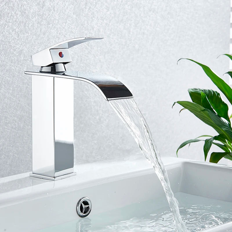 Black Waterfall Bathroom Faucet mounted on MC THE BLACK DIAMOND vessel sink in a modern bathroom setting.