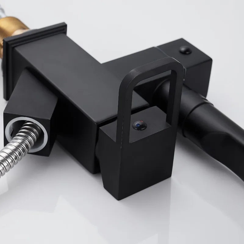 Black deck-mounted kitchen sink faucet with flexible pull-out spray, chrome finish, hot and cold water controls, spring spout by MC THE BLACK DIAMOND