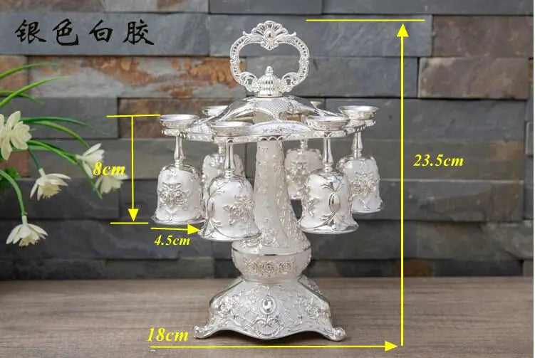 Set of six metal European whisky cups in gold and silver with decorative designs, perfect for stylish kitchen barware.