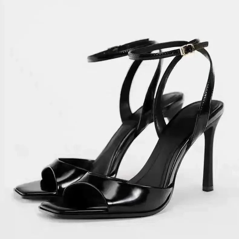 Gold patent leather ankle buckle high heel sandals for women by MC THE BLACK DIAMOND, featuring stylish ankle straps and a sleek design.
