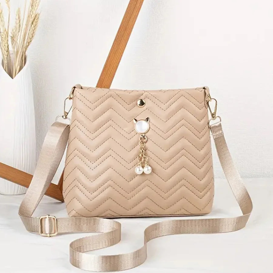 MC THE BLACK DIAMOND women's quilted crossbody bag with cat pearl pendant, stylish shoulder purse for holiday gifts.