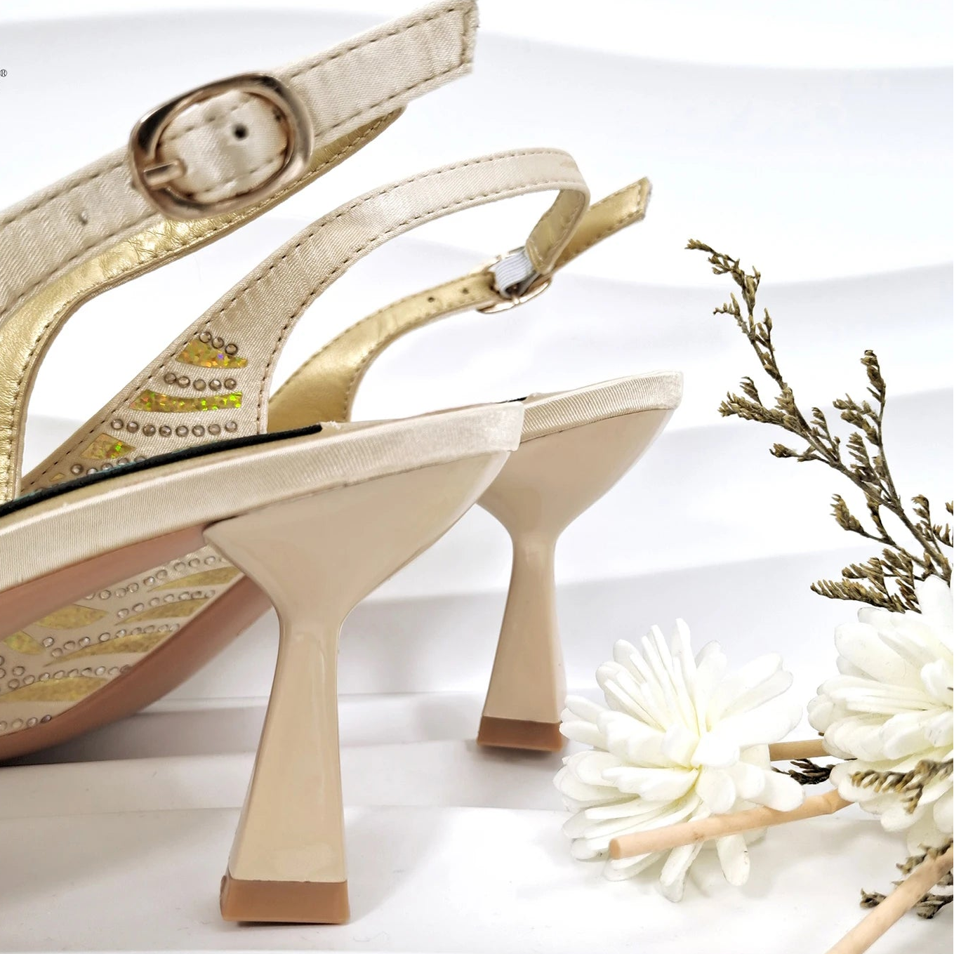 Nigerian style women heels and shiny clutch bags by MC THE BLACK DIAMOND, featuring pointed toe stiletto heels and elegant accessories.