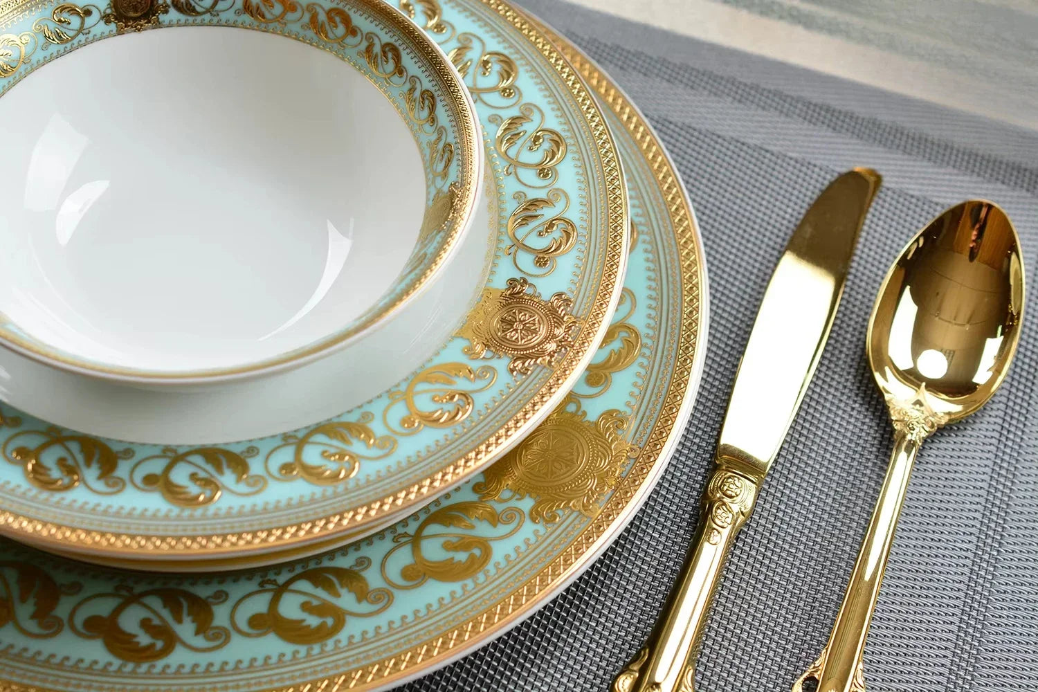 Embossed gold porcelain dinnerware set by MC THE BLACK DIAMOND, luxury bone china tableware with elegant embossed gold design.