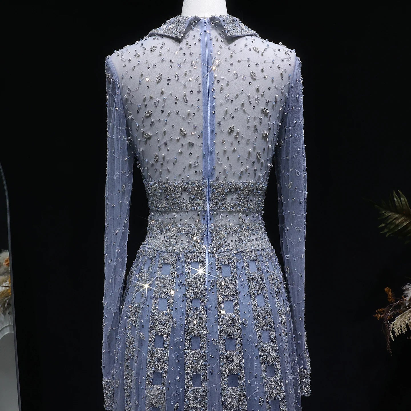 Elegant MC THE BLACK DIAMOND MC long sleeve formal evening dress with intricate detailing and a sleek silhouette.
