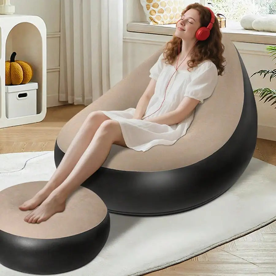 Flocked inflatable lazy sofa with footrest and foot pump from Mc The Black Diamond, foldable for home, office, or outdoor use.