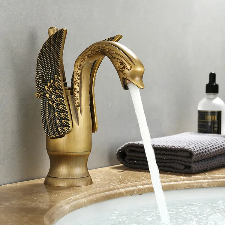 MC THE BLACK DIAMOND golden basin faucet with swan-shaped short deck mount sink mixer tap for hot and cold water.