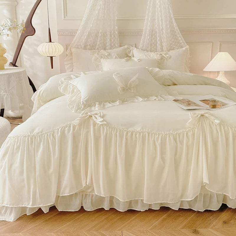 Three-piece white bedding set with ruffled duvet cover, bedsheets, and pillowcases from MC The Black Diamonds.