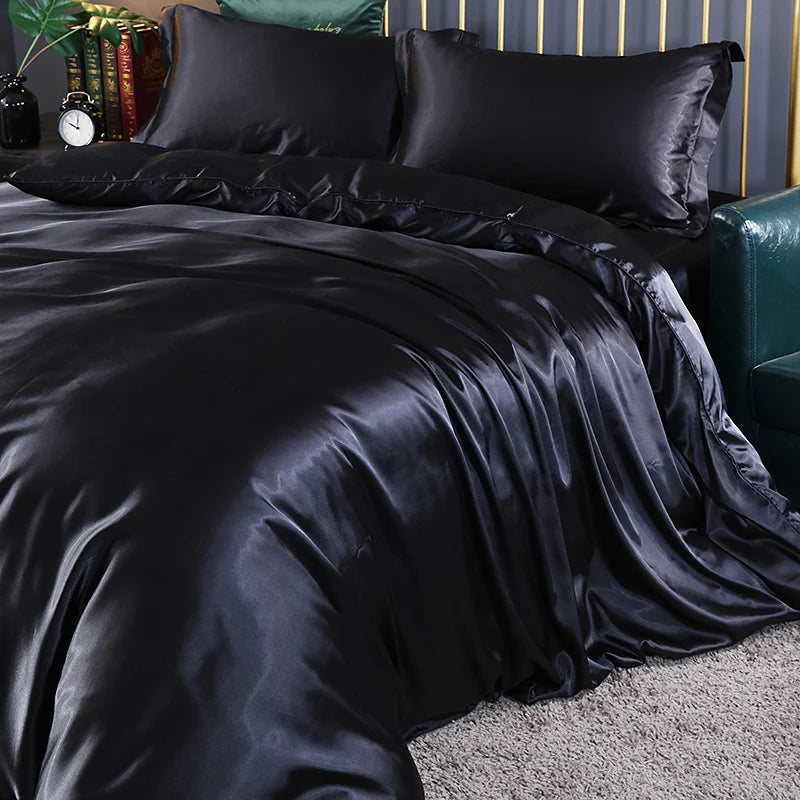 Luxury silk bedding set with duvet cover, fitted and flat sheets, and pillowcases in solid color, King and Queen sizes.