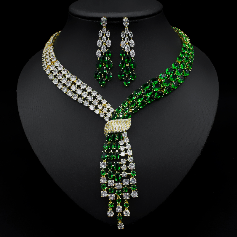 Handmade lab emerald and diamond jewelry set with 14K white gold wedding rings, earrings, and necklace for women and bridal occasions.