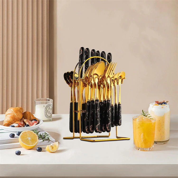 Stainless steel LMETJMA flatware set with knives, forks, spoons for six, featuring sleek kitchen cutlery arranged on a table.