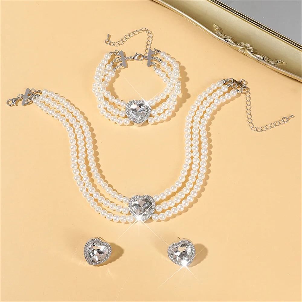 Elegant bridal jewelry set featuring a necklace and versatile earrings by MC THE BLACK DIAMOND, displayed with intricate design details.