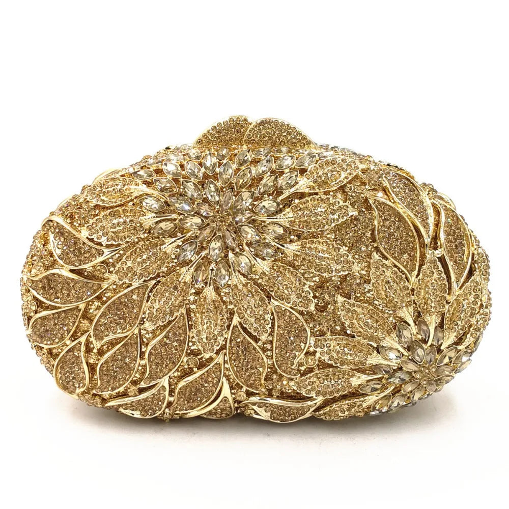 Gold metal leaves and white crystal evening clutch bag by MC THE BLACK DIAMOND, featuring rhinestones and a mini heart design for women.