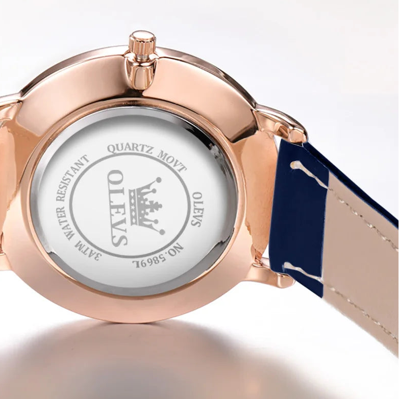 Oleves minimalist ladies' watch with leather strap, waterproof quartz movement, and calendar display, from Mohamad Collection.