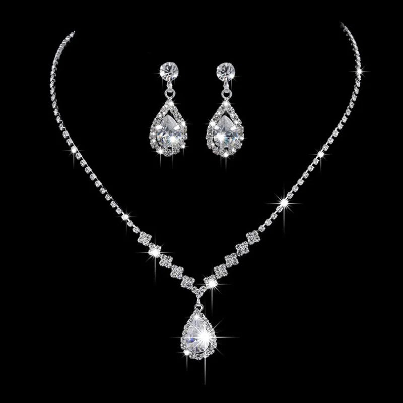 Vintage crystal waterdrop pendant necklace and matching earrings set in silver by MC THE BLACK DIAMOND, elegant wedding jewelry.