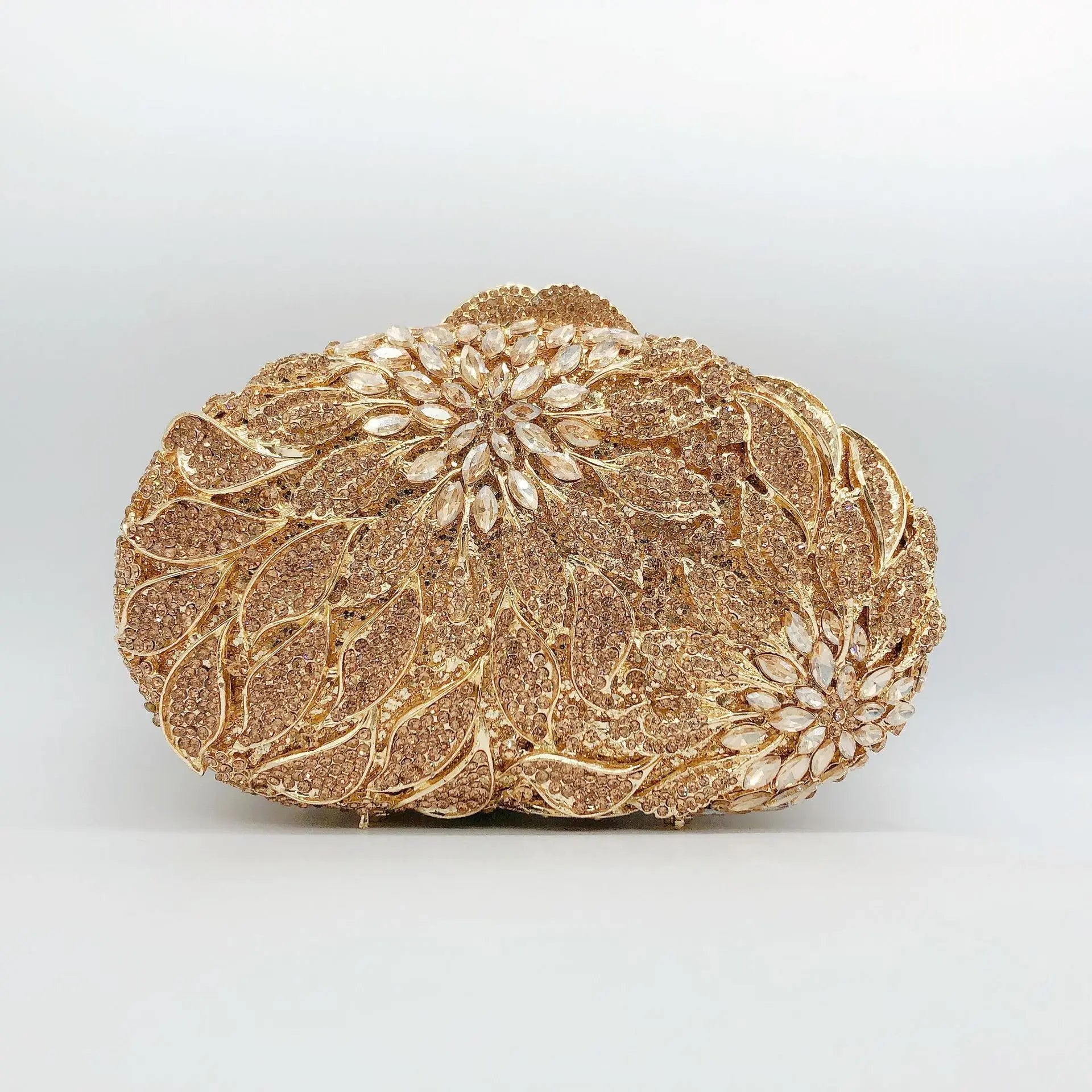Gold metal leaves with white crystal accents evening clutch bag by MC THE BLACK DIAMOND, elegant mini heart-shaped handbag for women.