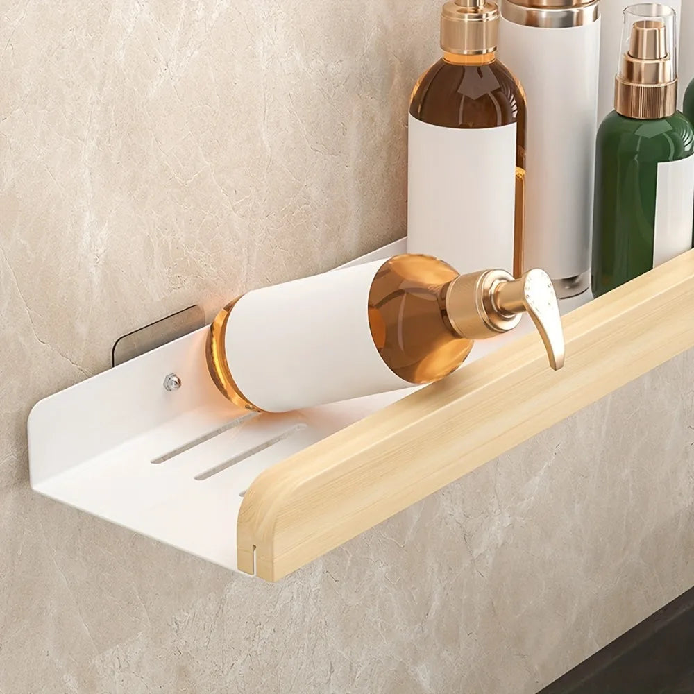 Wall mounted bathroom storage organizer by MC The Black Diamond, designed for shampoo bottles and bathroom accessories.