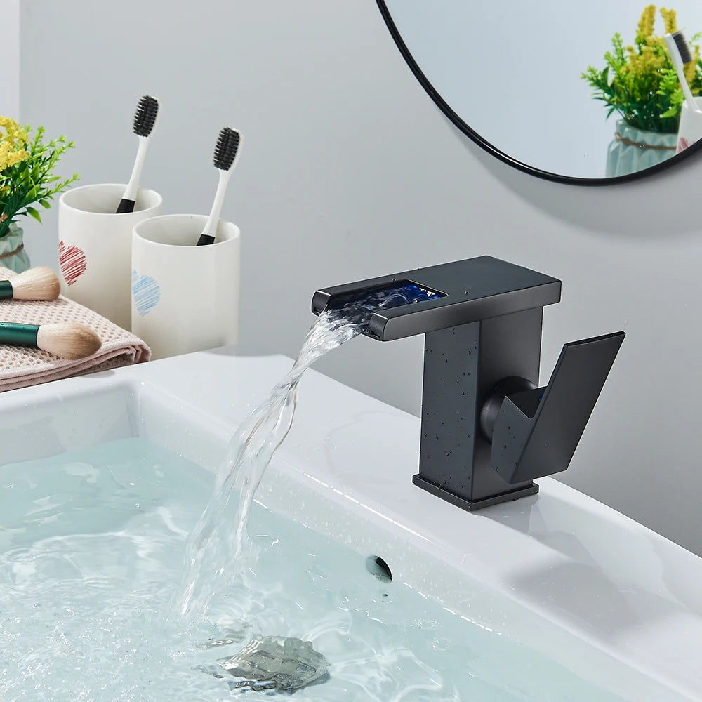 Black brass LED bathroom waterfall sink faucet with single handle, deck mount hot and cold water mixer tap from 𝕄𝕔 𝕋𝕙𝕖 𝔹𝕝𝕒𝕔𝕜 𝔻𝕚