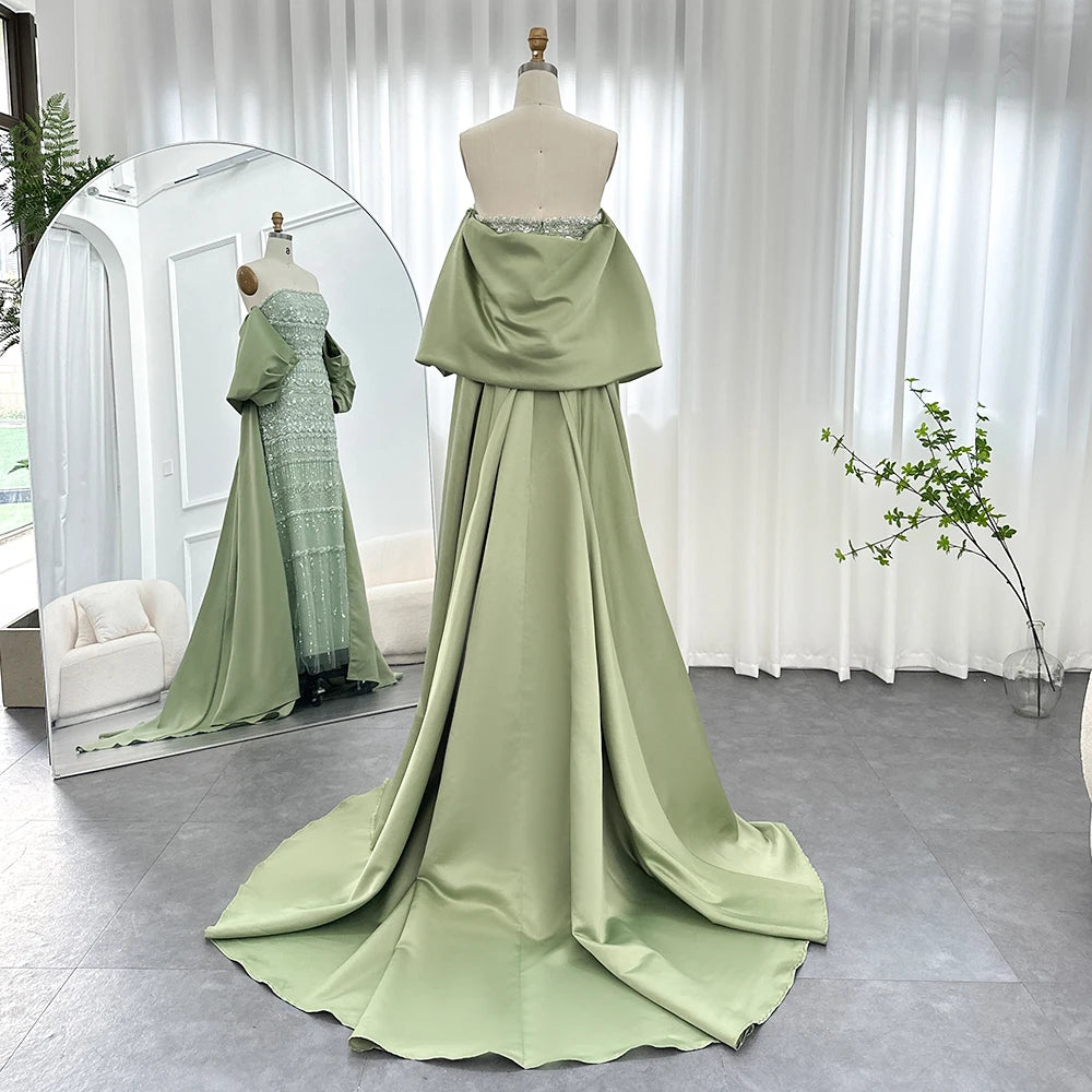 Sage green MC THE BLACK DIAMOND evening dress featuring elegant fabric and intricate detailing, perfect for formal occasions.