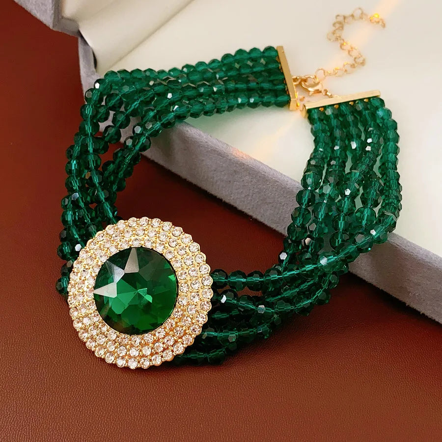 Elegant green jewelry set with rhinestone glass round stones, includes necklace and earrings, by MC THE BLACK DIAMOND.