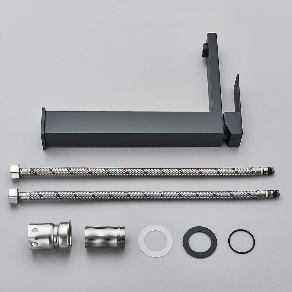 Matte black stainless steel bathroom sink faucet with hot and cold water mixer, deck-mounted waterfall style tap from 𝕄𝕔 𝕋𝕙𝕖 𝔹𝕝𝕒𝕔𝕜 𝔻�