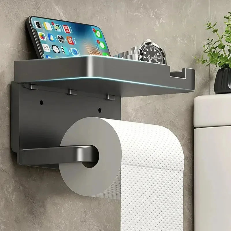 Plastic bathroom toilet paper holder with wall-mounted storage rack for towels, seasoning bottles, and phone in a modern kitchen or bathroom.