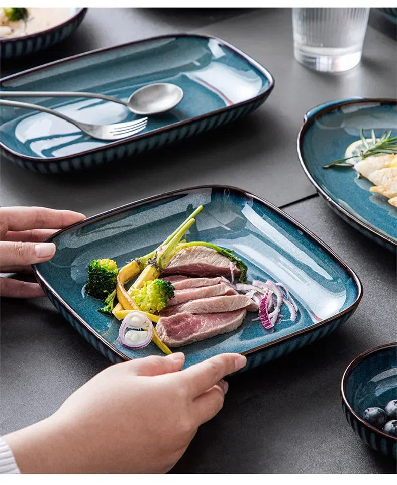 Blue kiln glaze ceramic plate from Mc The Black Diamonds, ideal for rice or salads, showcasing a glossy blue finish.