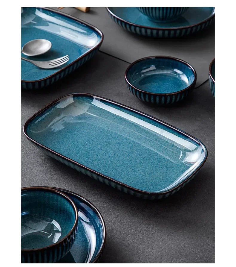 Blue kiln glaze ceramic rice salad plate from MC The Black Diamonds, showcasing a smooth, glossy finish and traditional kitchenware style.