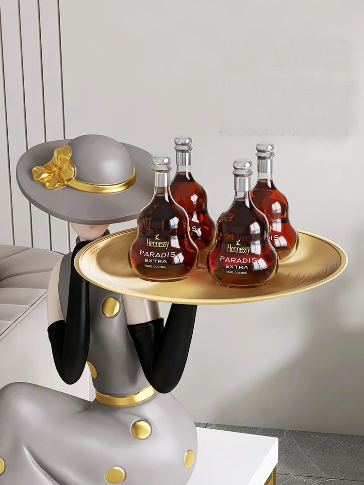 MC THE BLACK DIAMOND large light luxury art figurine displayed on a decorative tray in a living room setting.