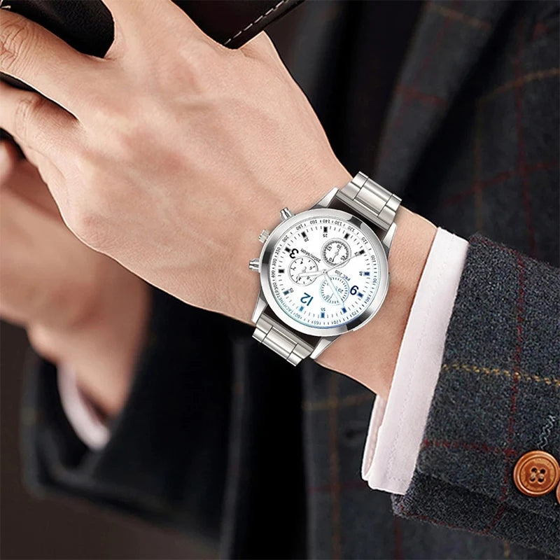 Pair of MC The Black Diamonds his and hers matching watches with black dials and silver straps on a white background.