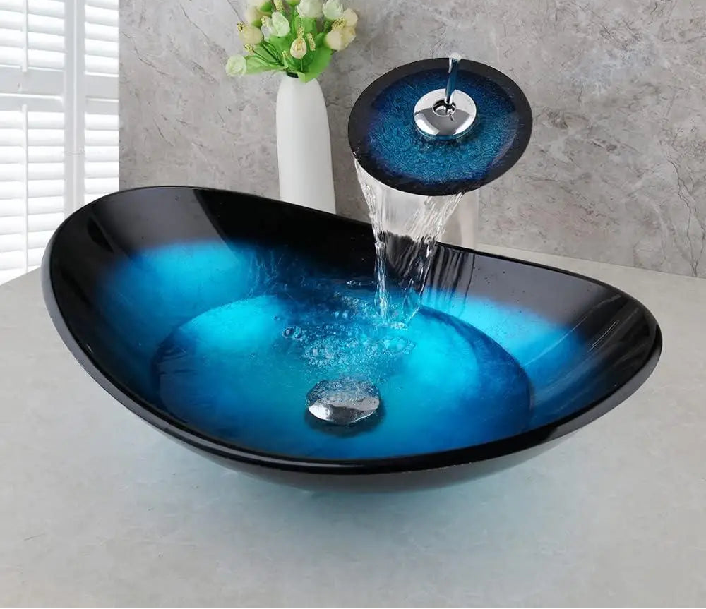 MC THE BLACK DIAMOND ZAPPO tempered glass bathroom vessel sink with blue oval basin and black waterfall faucet tap.
