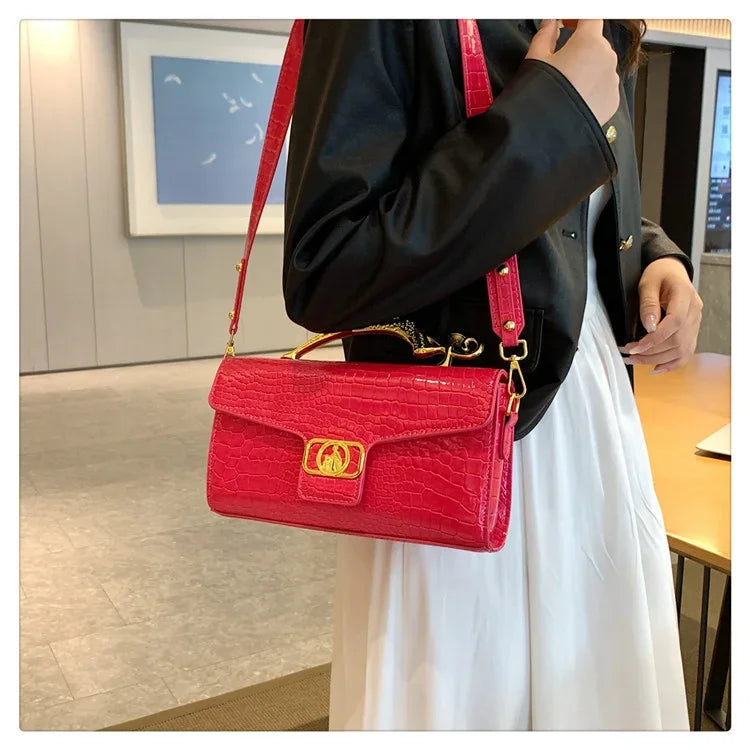 Women’s luxury leather shoulder bag by MC THE BLACK DIAMOND with metal buckle, simple stylish design, perfect for parties and everyday use.