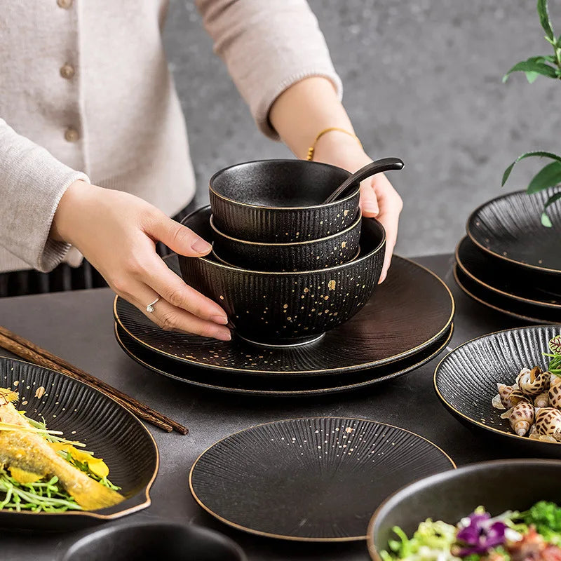 Black porcelain dinner plate with gilt rim from 𝕄𝕔 𝕋𝕙𝕖 𝔹𝕝𝕒𝕔𝕜 𝔻𝕚𝕒𝕞𝕠𝕟