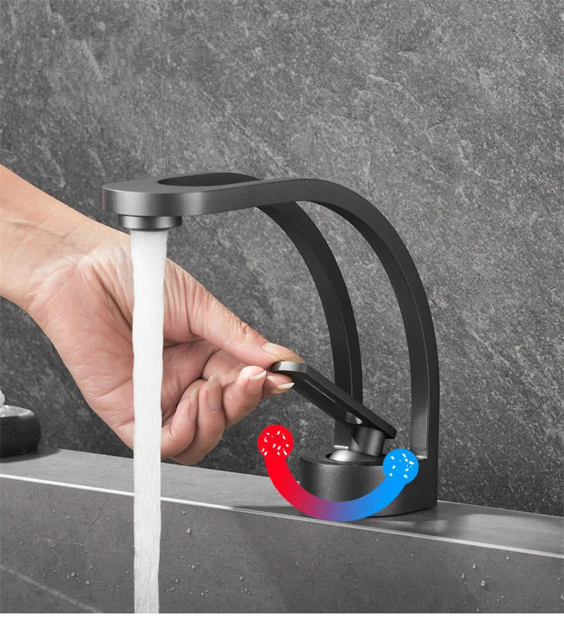 Black and gold MC THE BLACK DIAMOND bathroom mixer tap with a modern design for wash basin installation.