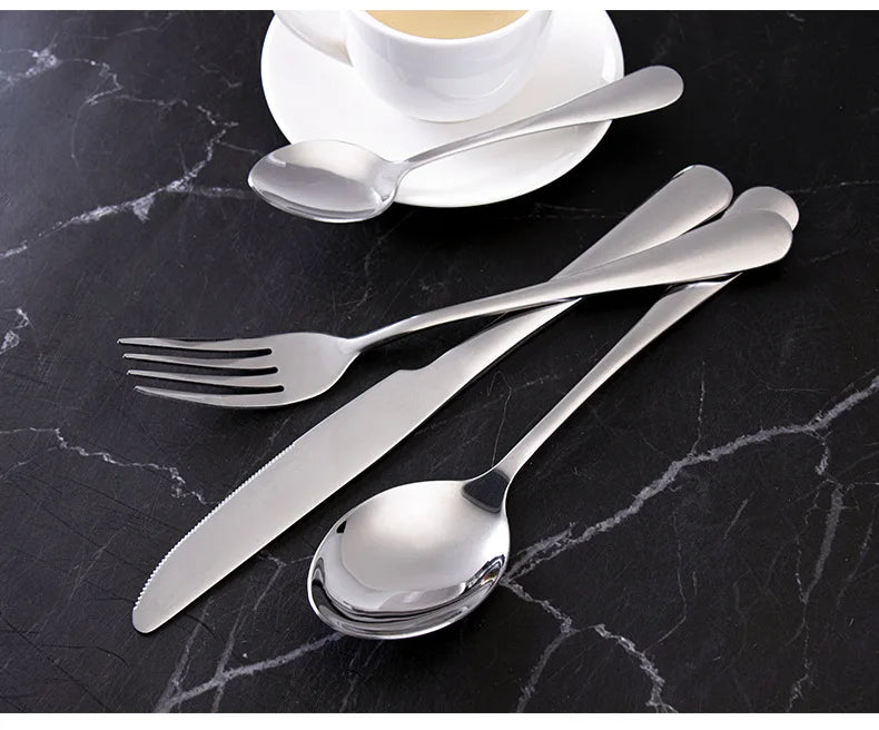 Stainless steel cutlery set with 24 pieces including knives, forks, and spoons, by 𝕄𝕔 𝕋𝕙𝕖 𝔹𝕝𝕒𝕔𝕜 𝔻𝕚