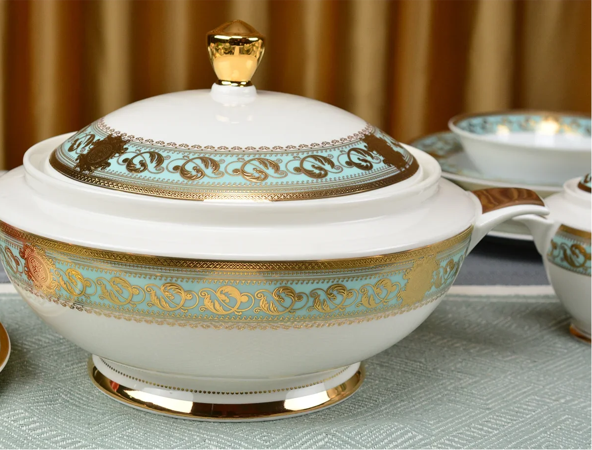 Embossed gold porcelain dinnerware set by MC THE BLACK DIAMOND featuring luxury bone china with intricate embossed gold designs.