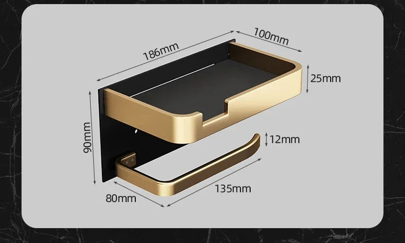 Black gold toilet paper holder by MC THE BLACK DIAMOND mounted on bathroom wall for stylish bathroom accessories.