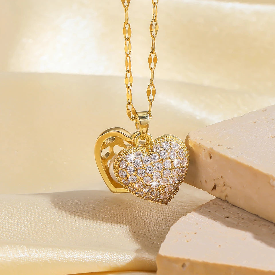 Gold ZAKOL French shell pearl necklace with love heart pendant, stainless steel chain, zircon accents, and elegant choker style for women.