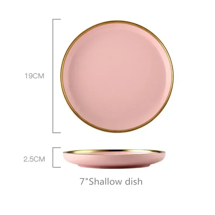 Gilt rim pink porcelain dinner plate from MC The Black Diamonds, featuring a smooth ceramic surface with elegant design details.