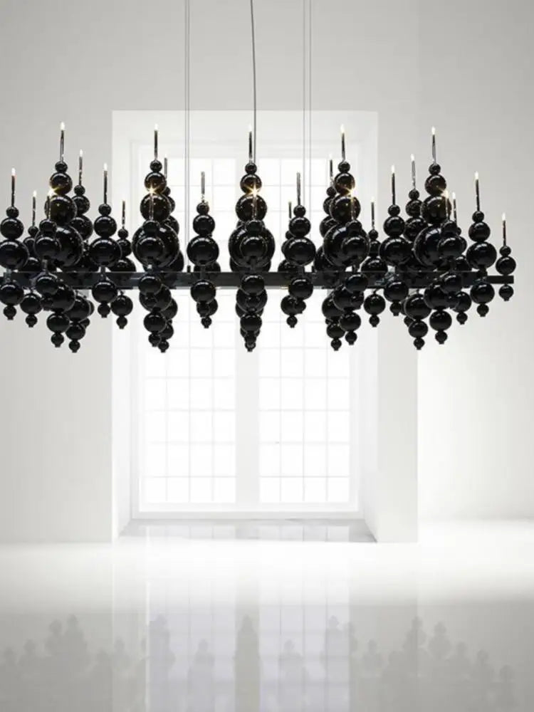 Luxury black chandelier by MC THE BLACK DIAMOND with tear-shaped moon design, hanging ceiling fixture for dining rooms or restaurants.