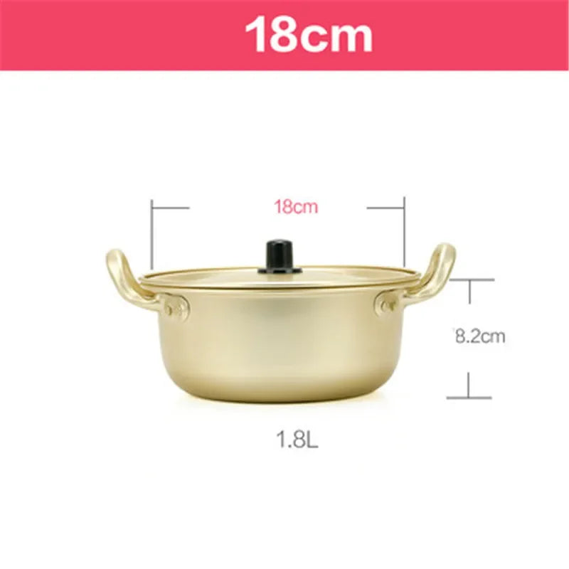 Korean style ramen noodles in a gold aluminum hot pot with egg soup, showcasing MC THE BLACK DIAMOND kitchen cookware.